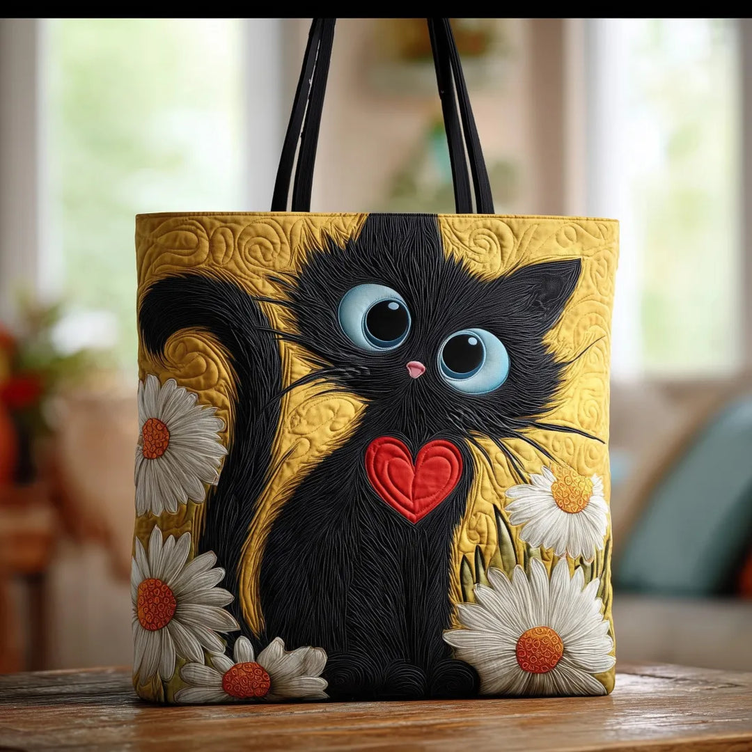 Gesteppte Tote Bag mit Motiv Schwarze Katze mit Gänseblümchen von Maria Zürich